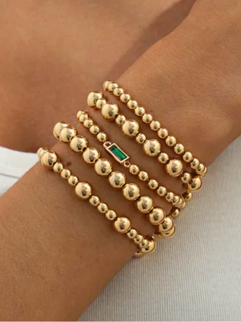 Gold Beaded Stretch Bracelet Stack with Emerald Accent